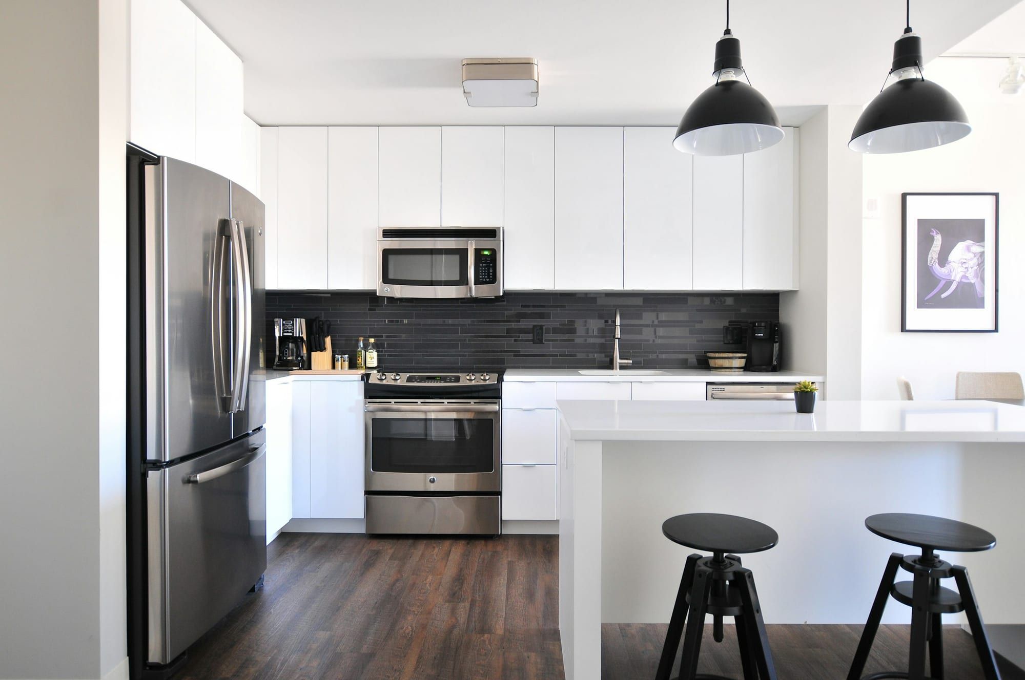 Modern kitchen with a stainless steel refrigerator, range and over-the-range microwave